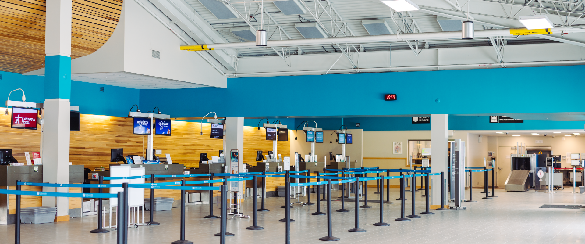 The image depicts airport terminal check-in counters.